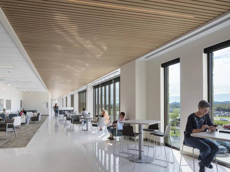 Interior view of a brightly lit waiting area in a hospital.