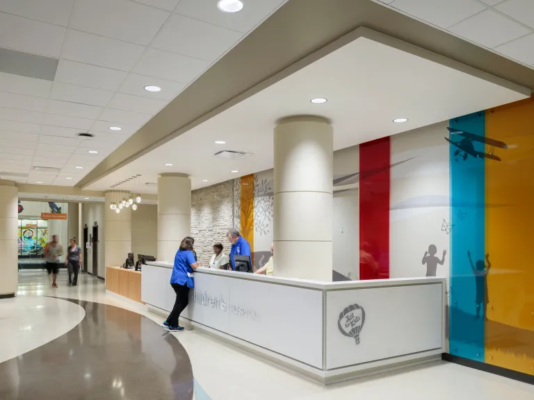 lobby with colorful wall graphic and registration desk