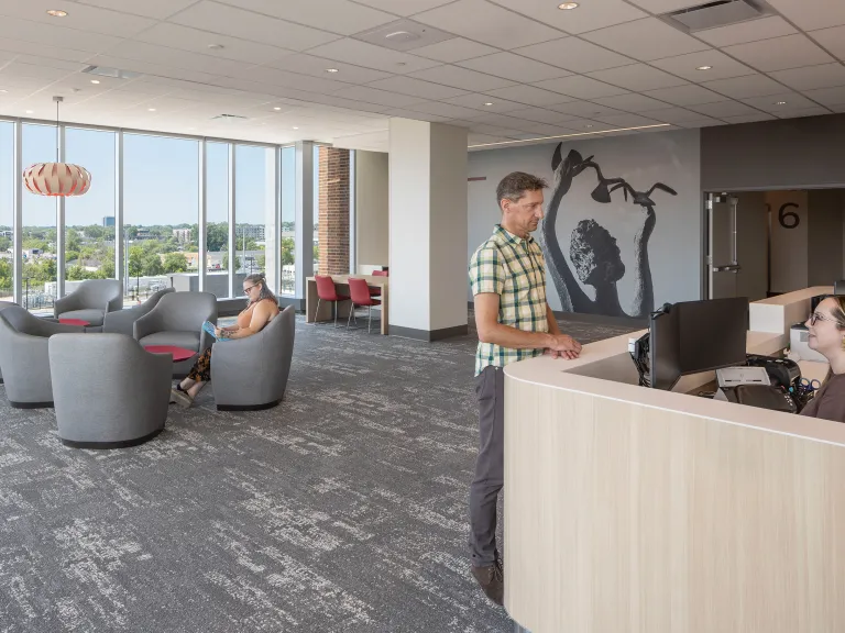 surgery department lobby with mural and campus views