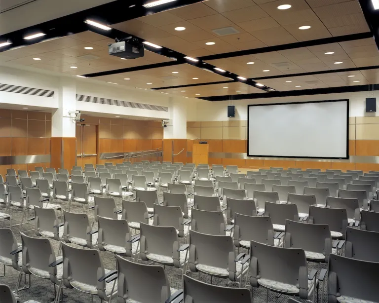 room with chairs and screen