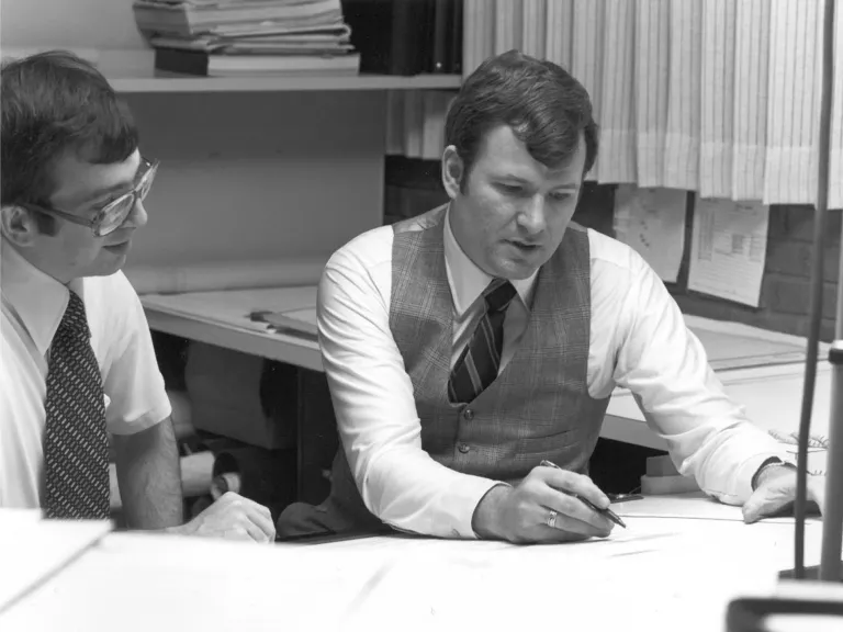 two men working at desk