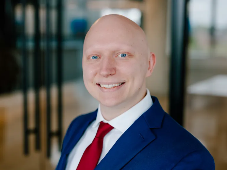 portrait photo of man in blue suit