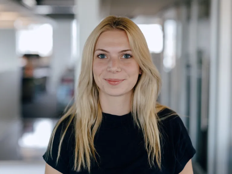 woman with blonde hair and black shirt