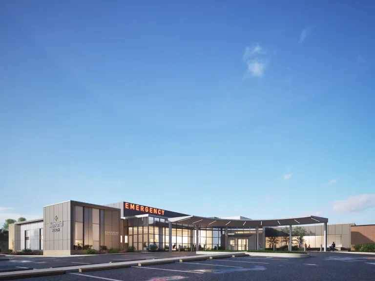 Rendering of emergency department building entrance at dawn.