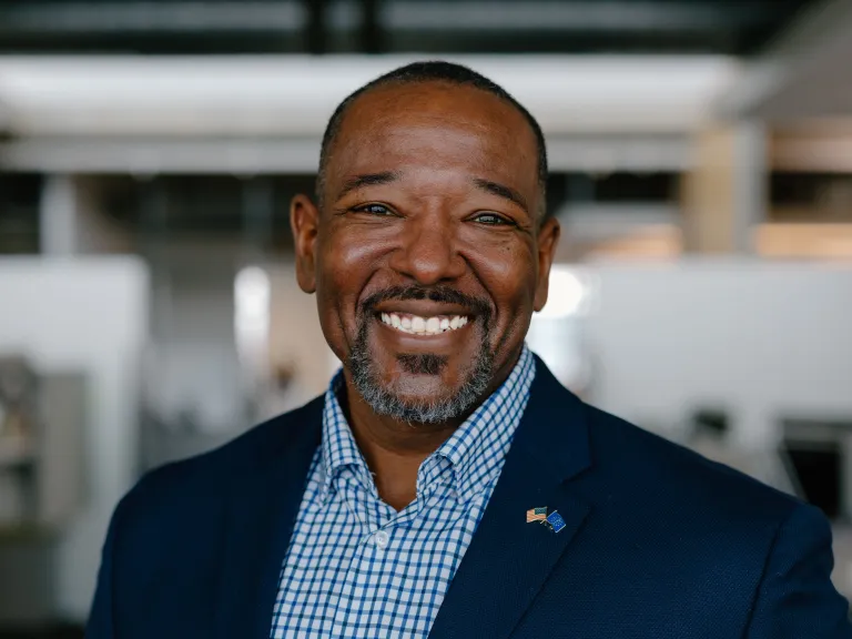 man with blue shirt and jacket