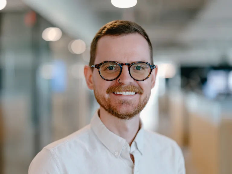 man with glasses wearing white shirt