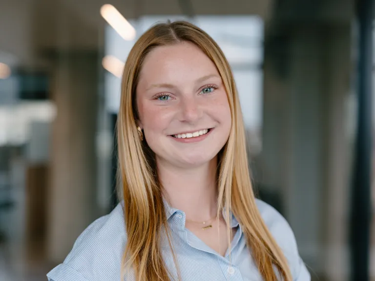 woman with straight long hair wearing light blue shirt